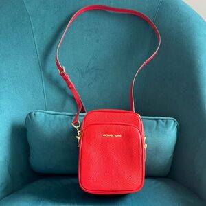 Michael Michael kors red crossbody/flight bag